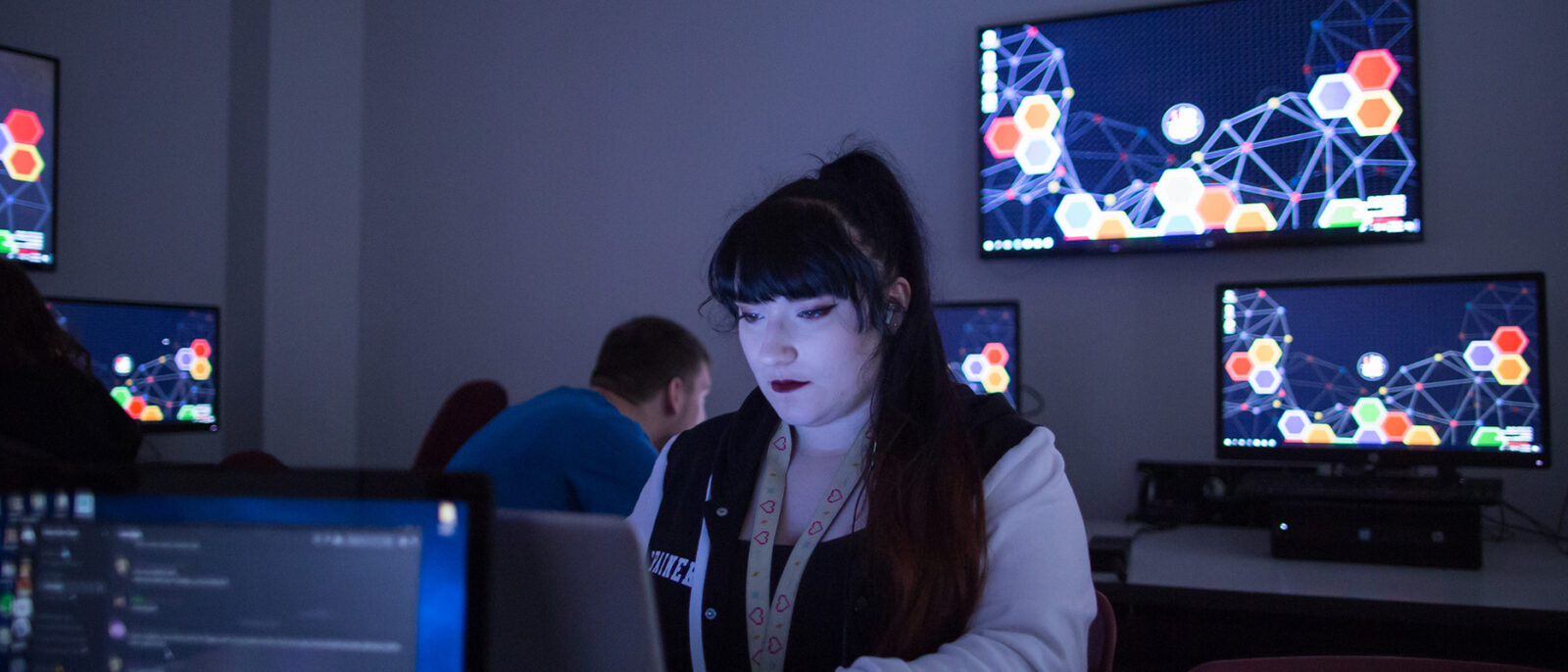 Female student in cybersecurity classroom