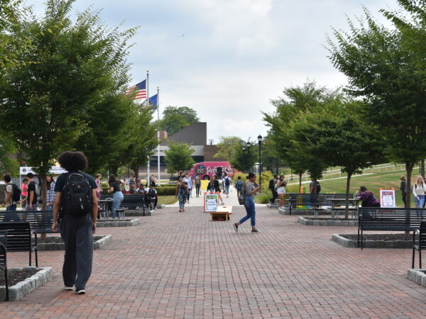 Image shows students walking on the Main Campus mall area.