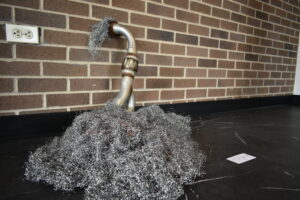 Image shows one of Kas's sculptures on display in the Glass Box Gallery in the Rothrock Library.