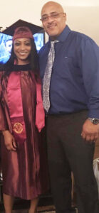 Saschelle Mandoza in grad regalia