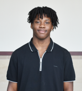 Photo of Silas Taylor in front of blank wall.