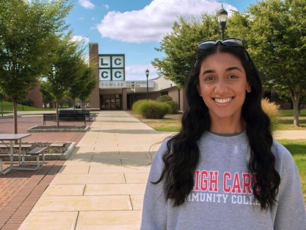 Student on the mall smiling