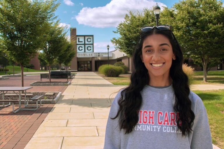 Student on the mall smiling